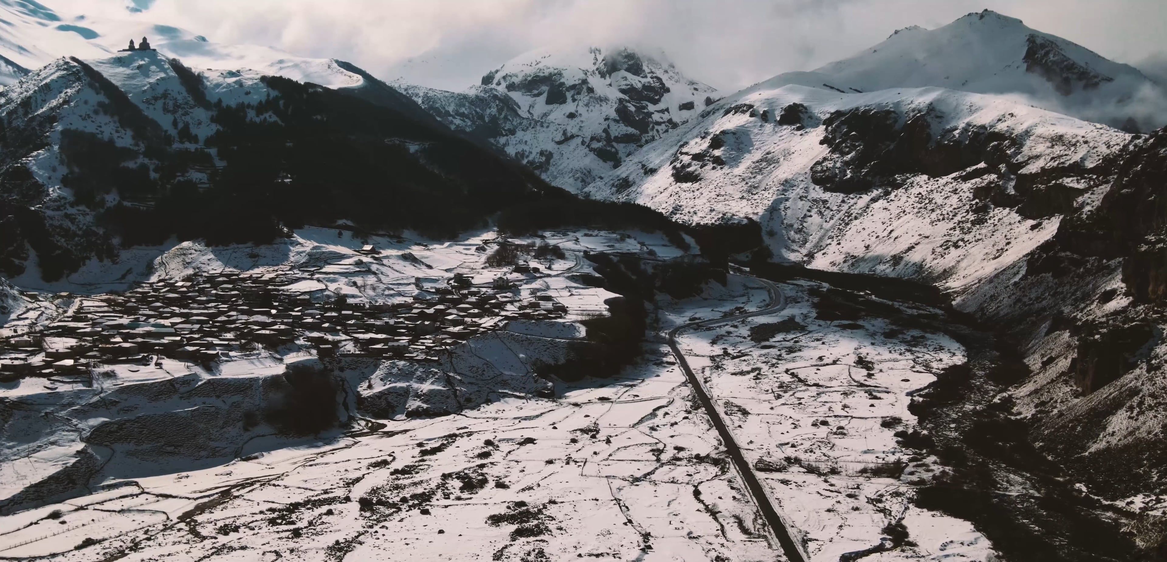 Drone Footage of Snow Capped Mountains and Village Free Stock Video ...