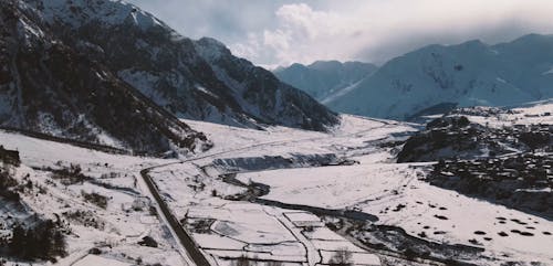 Valley and Mountains Under Snow