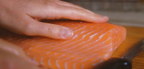 Person Rubbing the Salmon