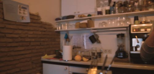 Bartender Making Drinks from Behind the Bar