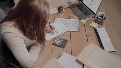 Woman Working on Office Desk