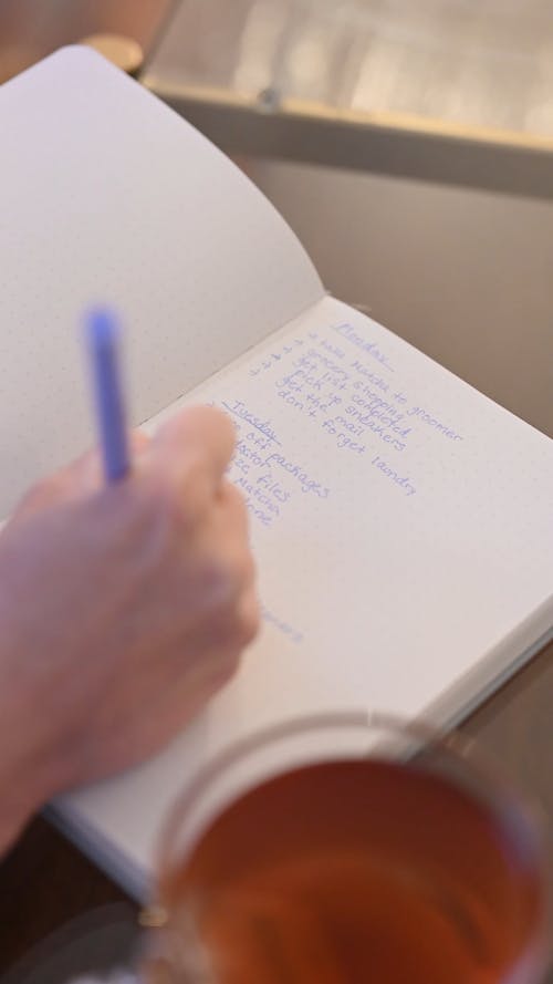 Person Writing a To Do List