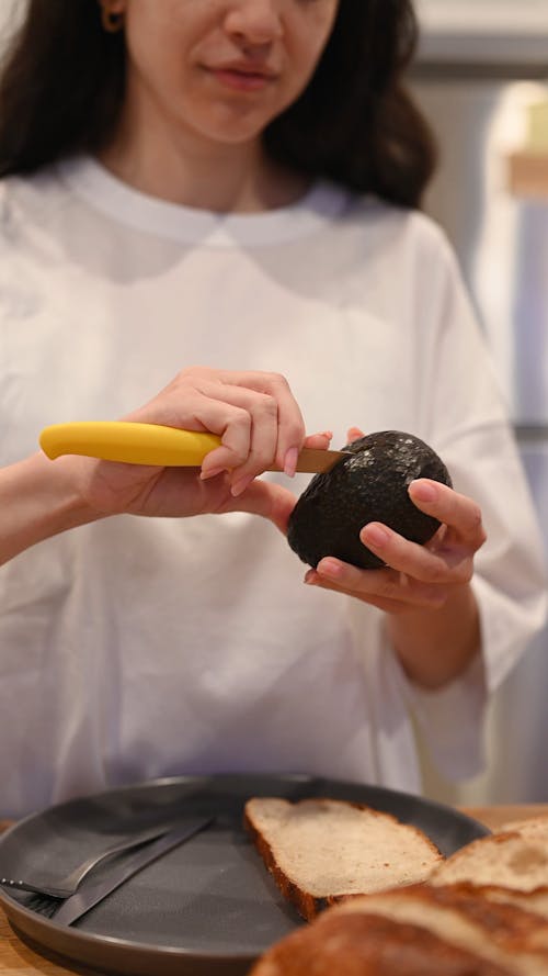 Woman Making Avocado Toasts