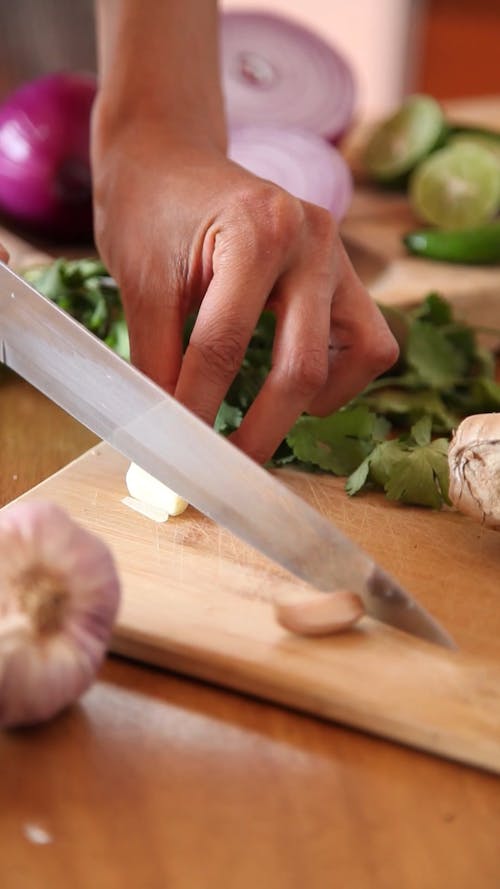 Person Chopping Garlic