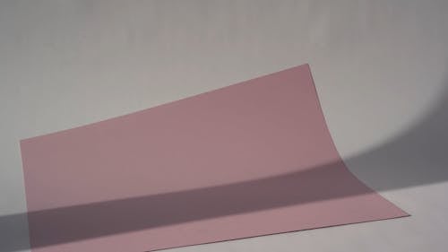 Placing A Globe On Top Of The Pink Paper