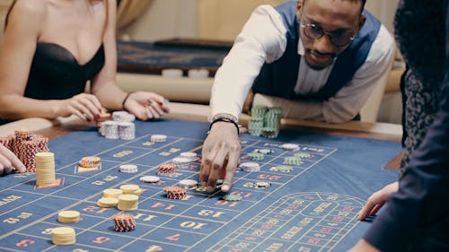 People Playing Casino Chips