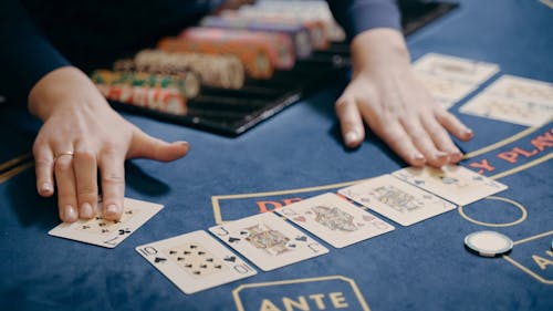 A Casino Dealer Spreading Chips
