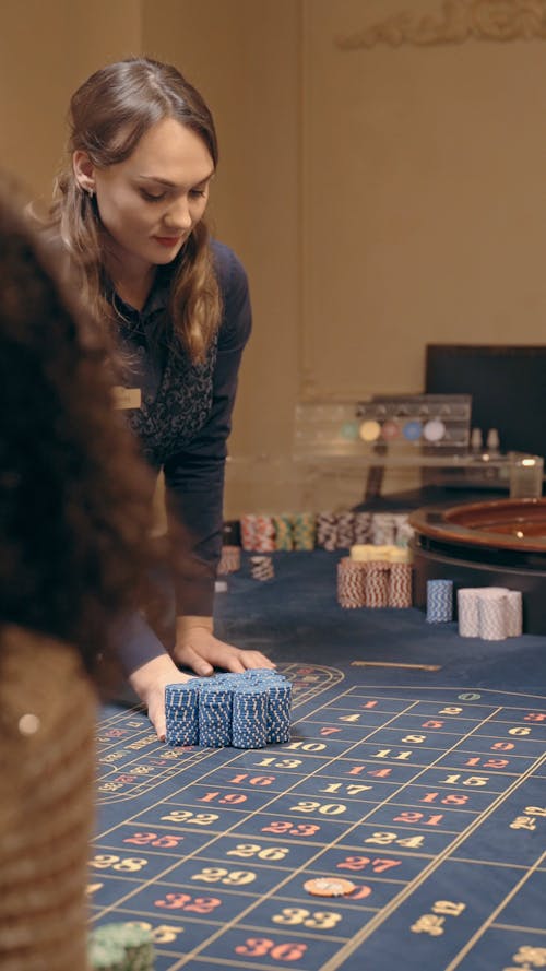 A Dealer Giving Poker Chips 