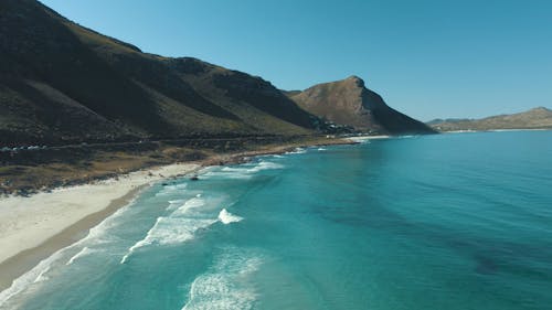 Drone Footage of a Beach and Mountains