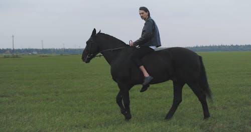 Man Horseback Riding