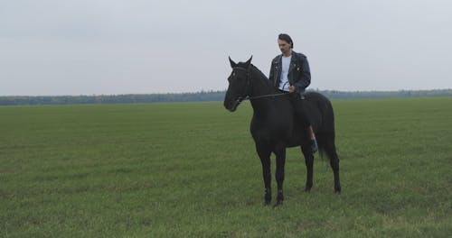 Man Horseback Riding