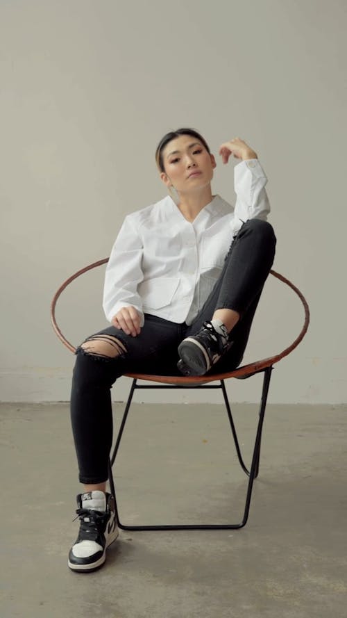 Female Model Posing In A Chair