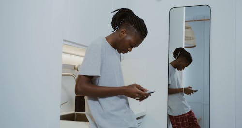 A Young an Using His Cellphone