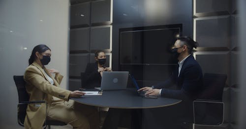 Colleagues Having a Meeting Wearing Face Masks