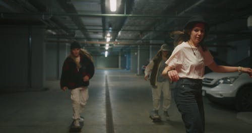 Girls Skateboarding in a Parking Lot