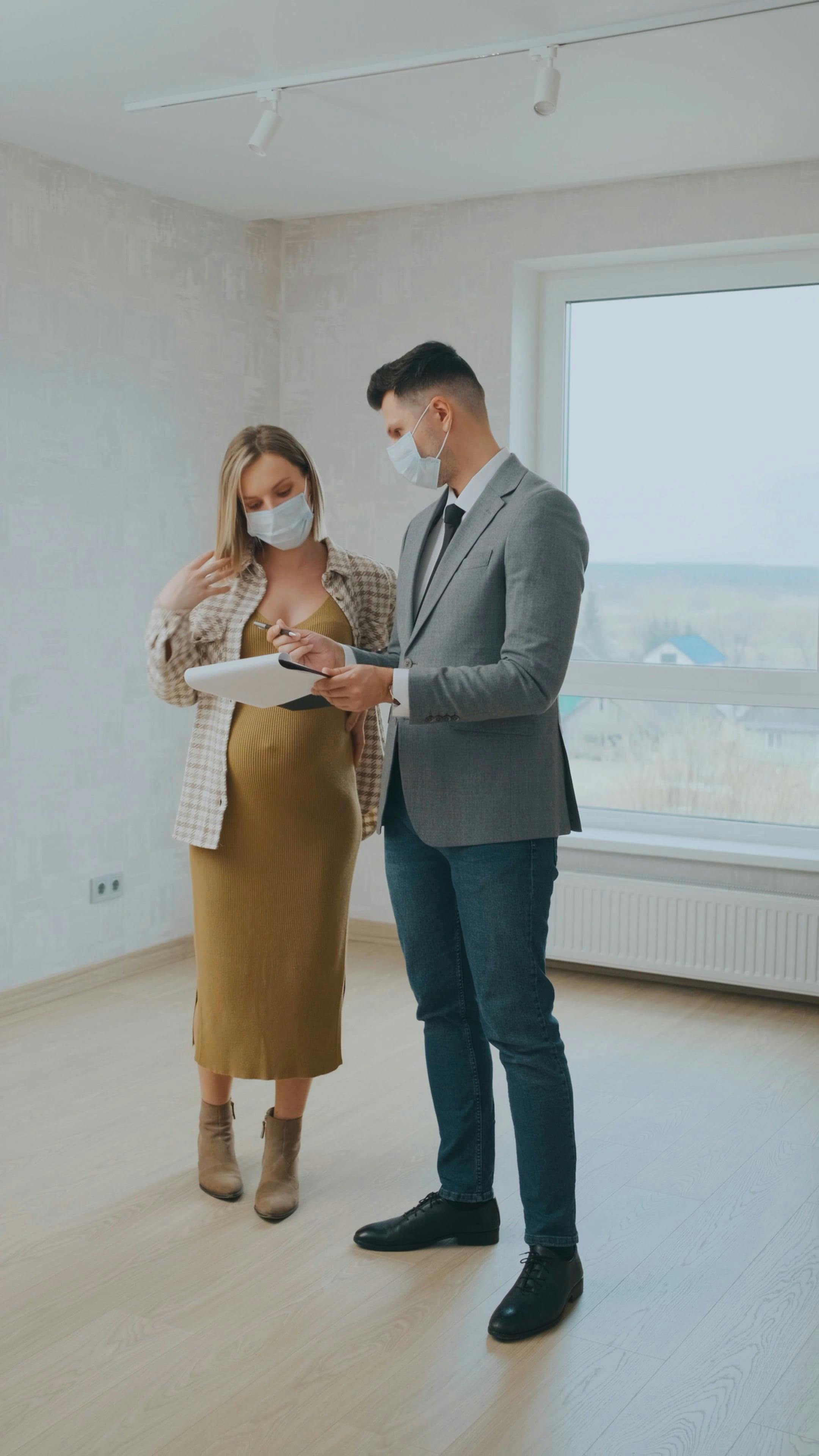 Couple Leaving a Realtor Inside of an Unfinished House · Free Stock Video