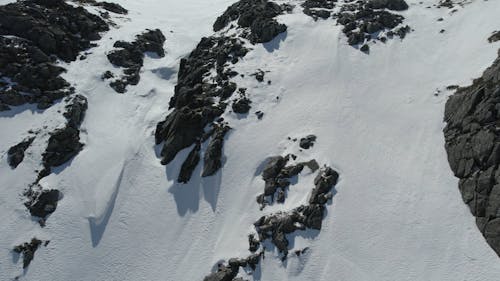An Aerial Footage of a Snow Capped Mountain