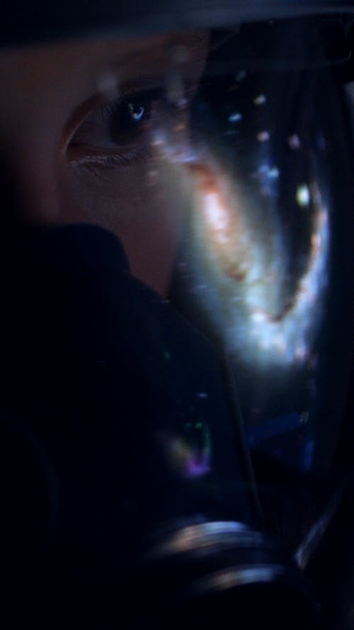 Galaxy Reflected on Astronaut Helmet