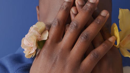 Close-up Video of a Man Holding Flowers
