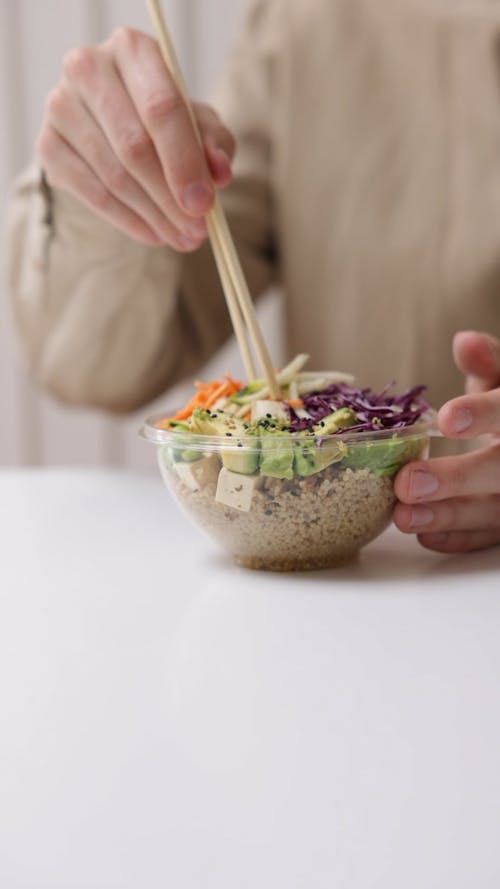 Person Eating Rice Bowl