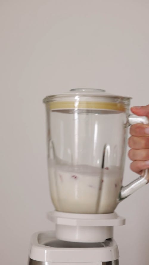 Person Making Fruit Shake