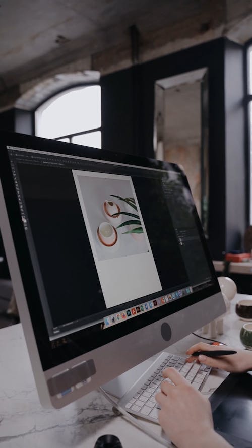 Panning Shot of a Woman Working on Her Computer
