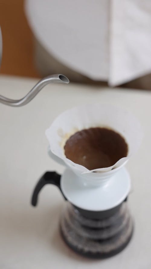 Pouring Hot Water on Coffee