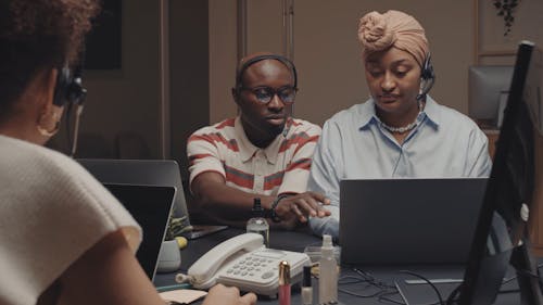 A Call Center Representative Training a Woman