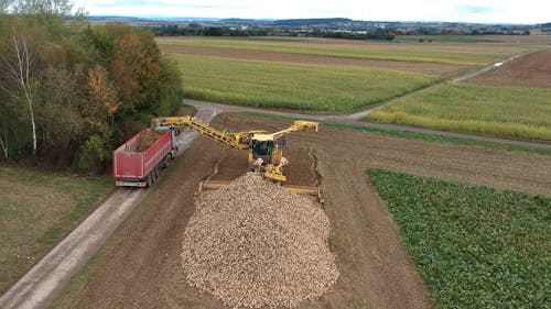 Aerial Footage of Using a Heavy Equipment in Agriculture