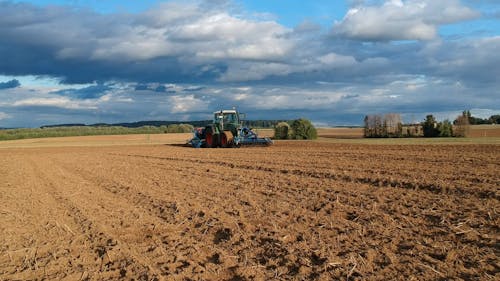 Drone Footage of a Tractor Working in a Field