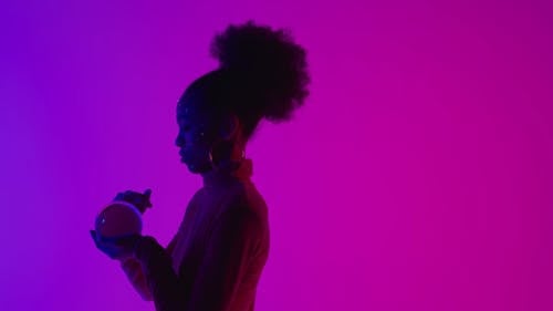 A Woman Holding a Crystal Ball