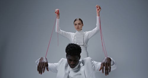 Man and Woman Tied With Threads