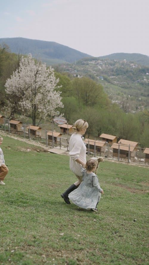 Mother and Daughters Walking at the Farm