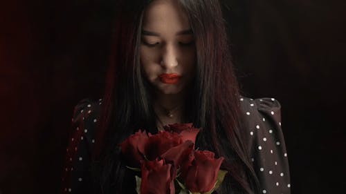 Woman Holding Red Rose