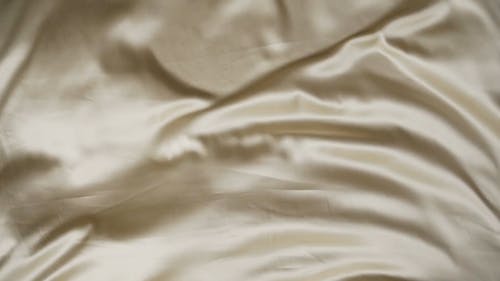 Close-Up Video of a Gold Silk Cloth