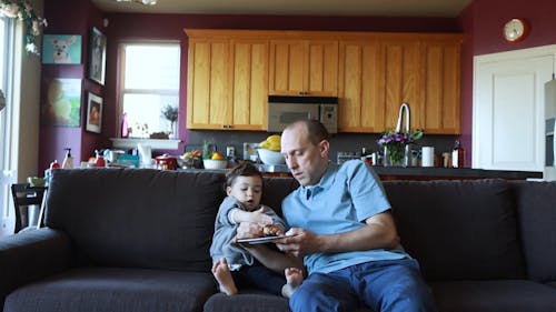 A Family Sitting on a Couch