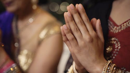 Indian Women Praying in Traditional Clothing