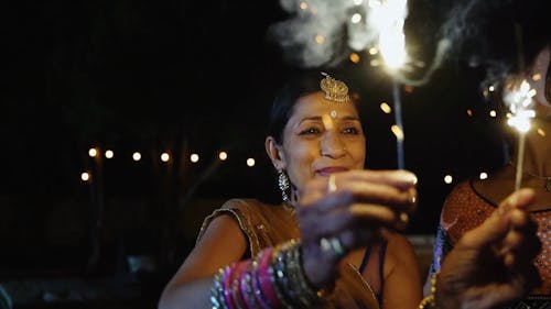 Women Partying Holding Fireworks