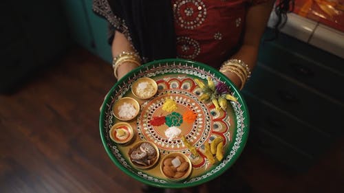 High Angle Shot of a Person Holding a Platter with Food