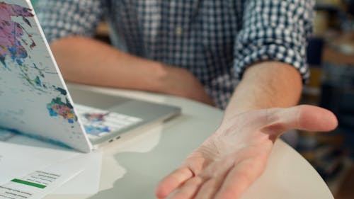 A Persons Hand and a Chart