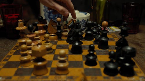 Close-Up View of People Playing Chess