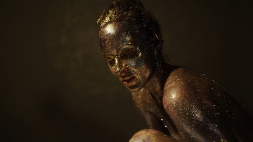 A Woman With Body Paint and Glitters