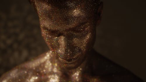 Face of a Man Covered in Glitter