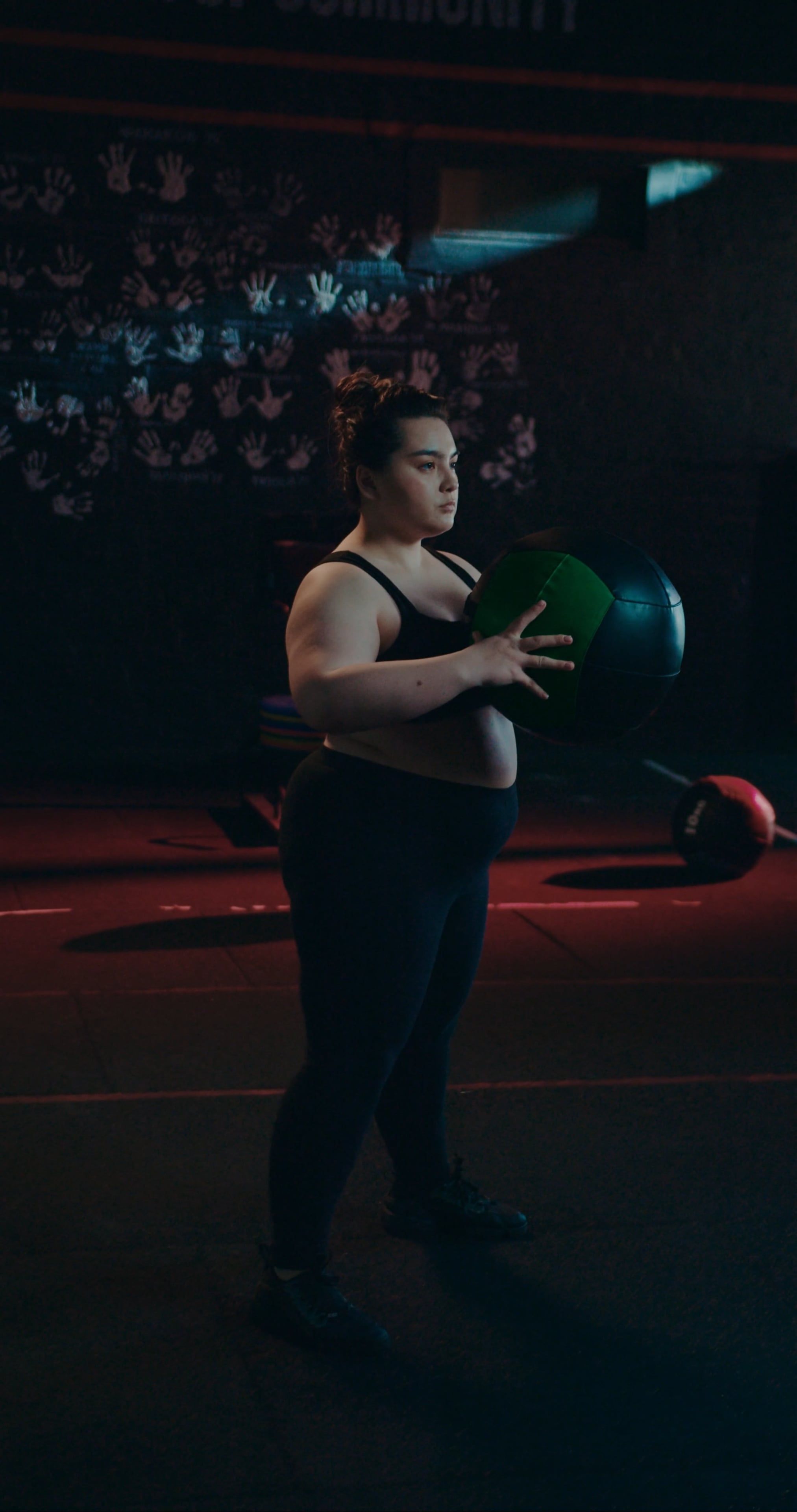 A Woman Squatting While Carrying A Fitness Ball Free Stock Video ...