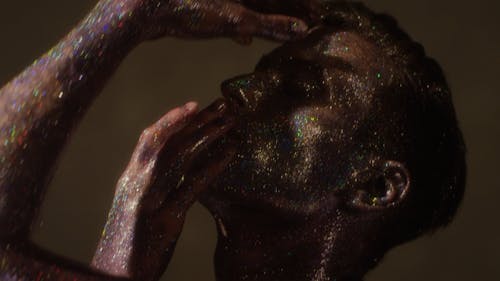 Close Up Video of a Man Covered in Glitter