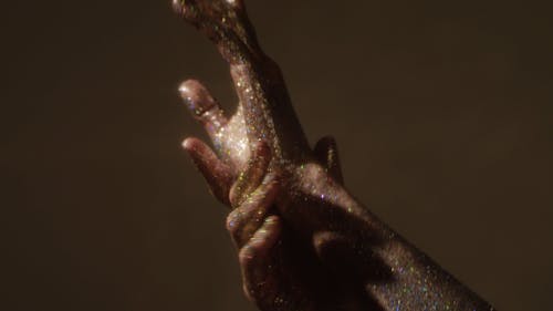 Hands Covered in Glitters