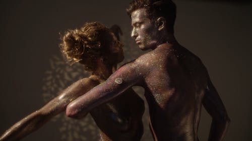 A Couple of Dancers Covered in Glitter