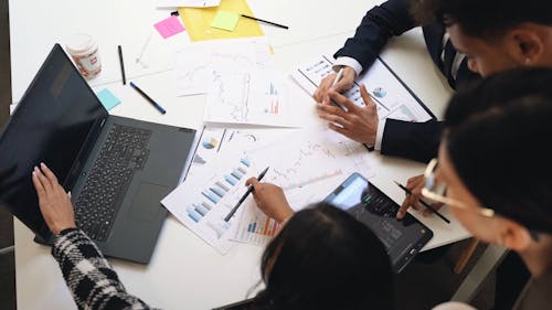 People Working Using a Laptop in the Office