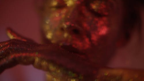 Close-up Footage of a Face Covered With Glitters