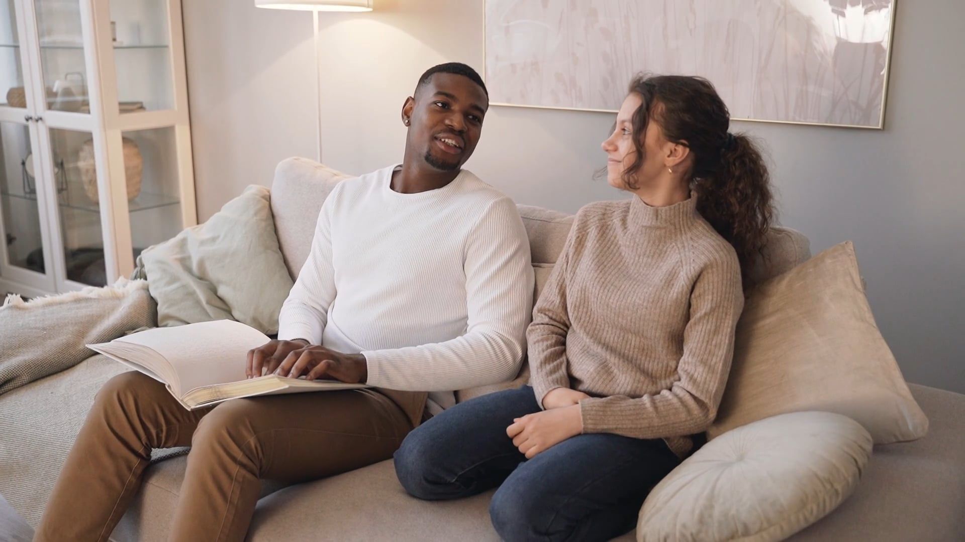 man-sitting-on-the-couch-using-a-braille-free-stock-video